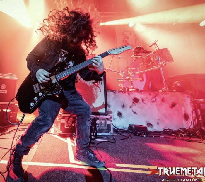 Brian under red stage light
